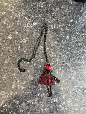 Black Doll Pendant Necklace with Red Glitter Skirt